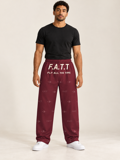 AI styling mockup — F.A.T.T Men's Flight Lounge Pants — Burgundy / Cream on an adult model. See product photos for garment details.